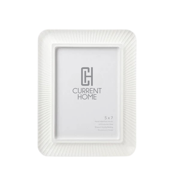 The Bella Moulding Rays Frame Snow White is a hand-crafted 5x7 frame with a textured, radiating edge pattern and a modern design that stands out on a plain white background.