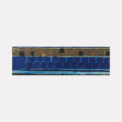 The artwork 'Vault Lights(Treads&Risers-4)' features horizontal bands of deep cobalt blue and weathered bronze, with circular perforations along the upper section. The textural encaustic and oil painting on birch panel creates a rhythmic industrial-inspired composition measuring 9x30 inches by Cora Jane Glasser.
